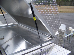 There's a gas assist lift on all our barbecue trailer grills
