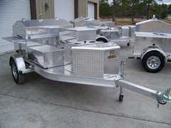 Front view of barbecue grill trailer with storage box 