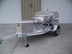 Side view of barbecue grill trailer with storage box 