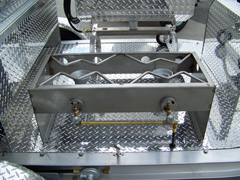 Two burner stainless stove on barbecue trailer grill